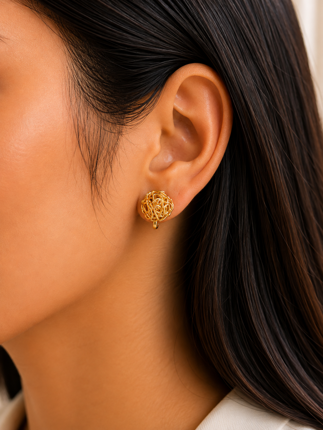 Aria gold-tone woven nest clip-on earrings for non-pierced ears by Emira Jewels UAE
